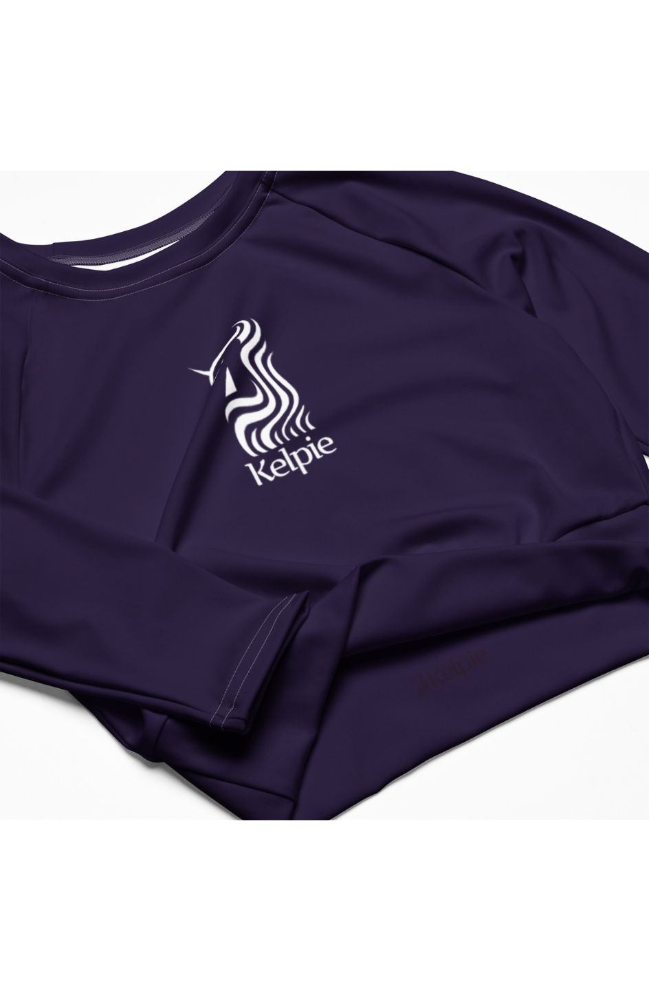 Kelpie purple long sleeve crop-top rash guard.